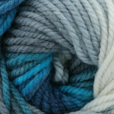 Close-up of blue, gray, and white yarn skeins.