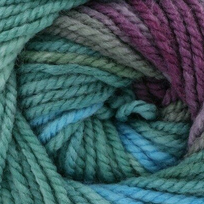 Close-up of a skein of multicolored yarn with shades of green, blue, and purple.