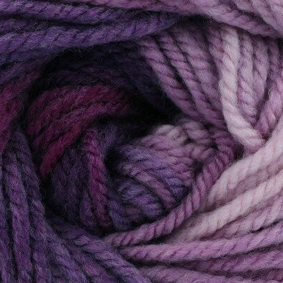 Close-up of a ball of purple yarn with a gradient effect.